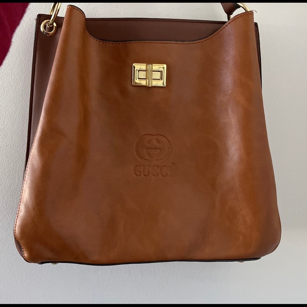 Gucci bag. It comes with a belt so you can use it like a cross body